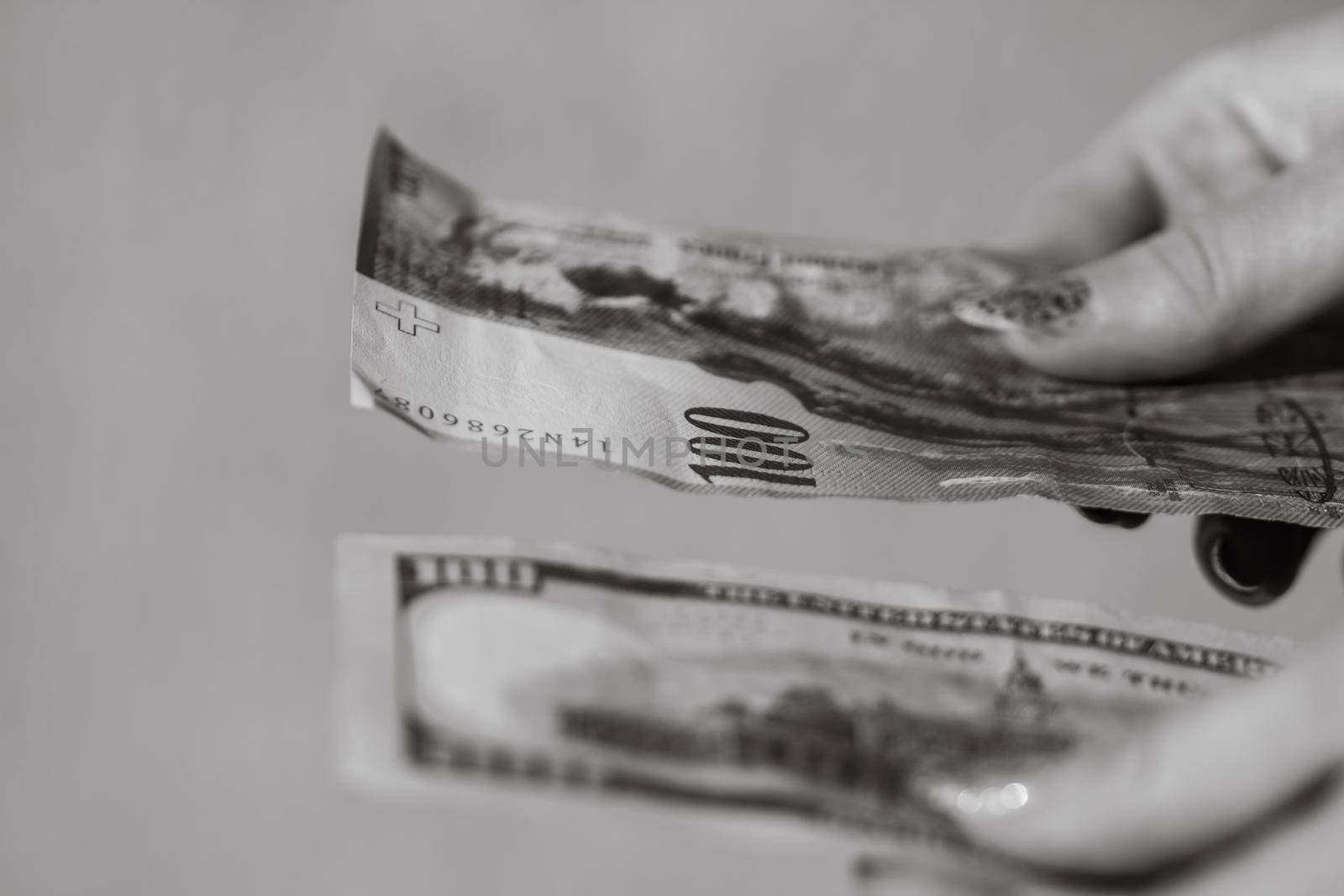 Detail of 100 USD banknotes next to 100 CHF banknotes. Detail of United States Dollar and Swiss Franc. World money concept, inflation and economy concept