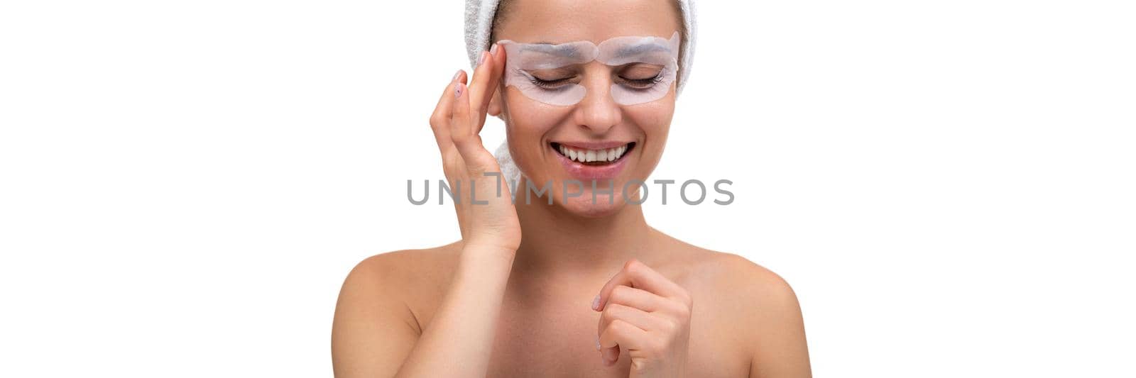 young woman takes care of the skin around the eyes, the concept of cosmetic procedures tour for female skin by TRMK