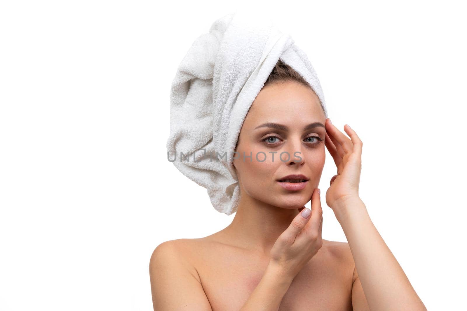 young woman after shower on white background skin care concept.