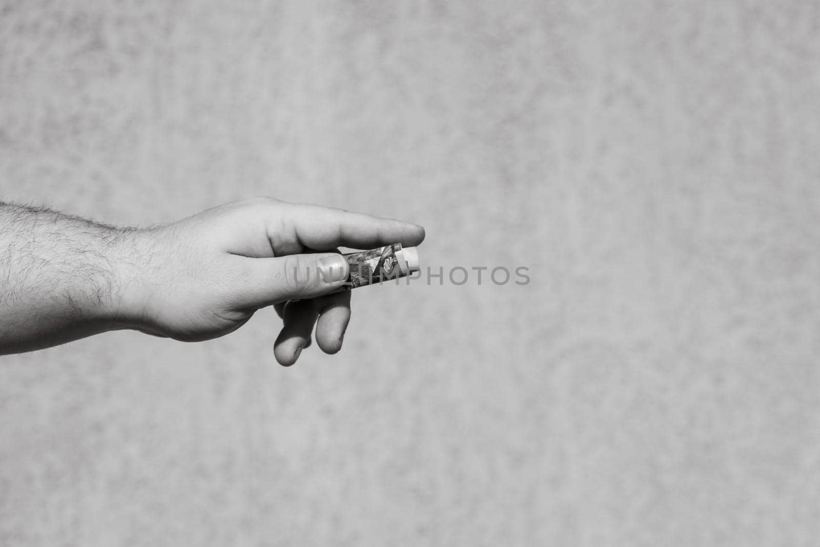 Hand holding showing dollars money and giving or receiving money like tips, salary. 100 USD banknotes, American Dollars currency isolated with copy space.