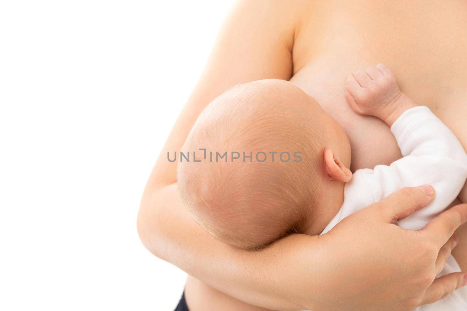 the baby drinks milk from the mother's breast on a white background, the child's health is passed from mother to child.