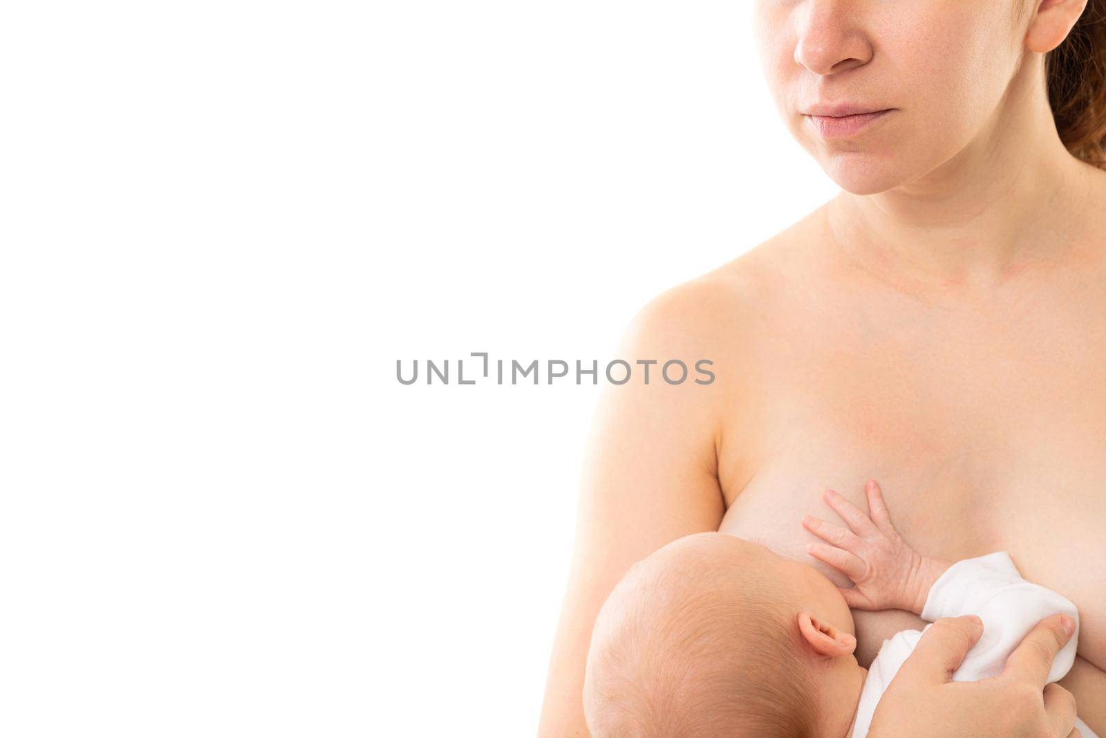 feeding a newborn on a white background with mother's milk.
