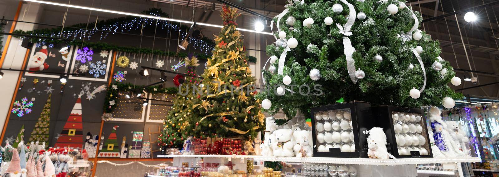 Minsk, Belarus - Nov 29, 2021: New Year's goods in the hypermarket, Christmas tree and Christmas decorations, Christmas goods by TRMK