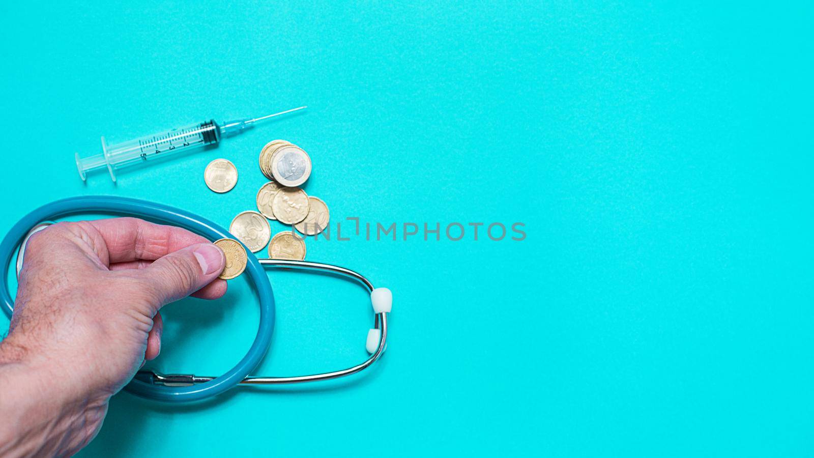 Syringe with vaccine on blue background from above by Ciorba