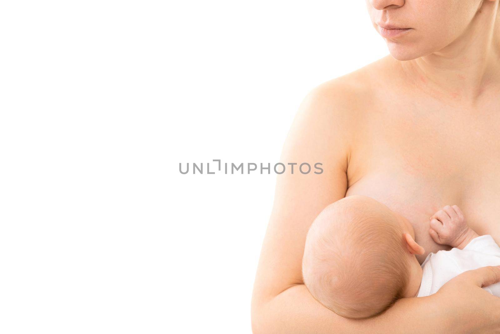 newborn baby takes mother's breast and drinks milk on a white background.
