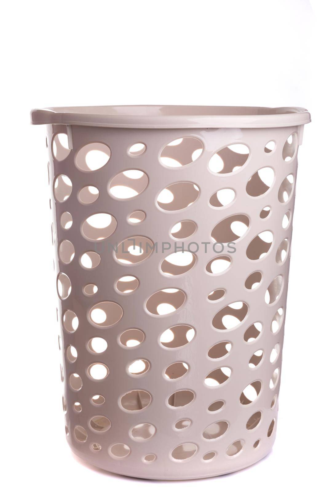 beige plastic empty basket for dirty laundry on white isolated background.