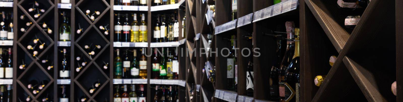 shelves of bottles of alcoholic beverages in a store selling wine and beer