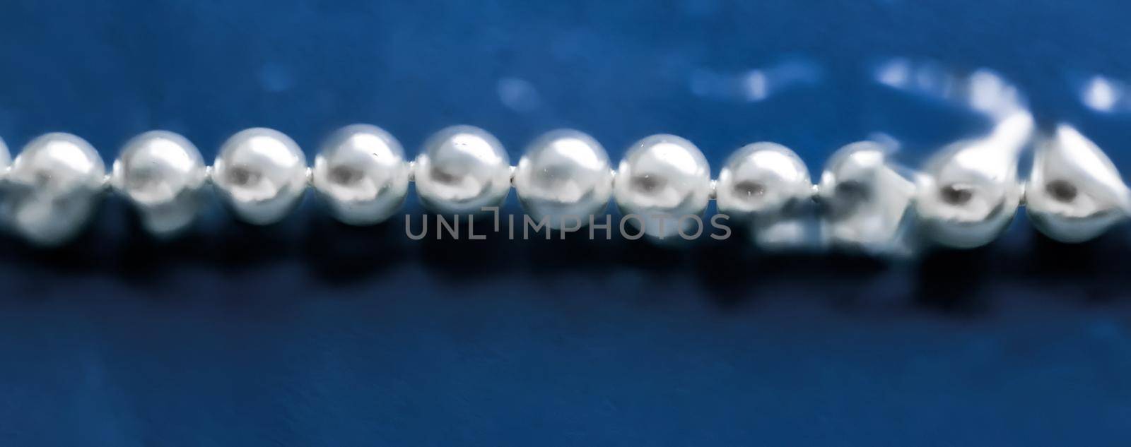 Jewelry, branding and gems concept - Coastal jewellery fashion, pearl necklace under blue water background, glamour style present and chic gift for luxury jewelery brand, holiday banner design