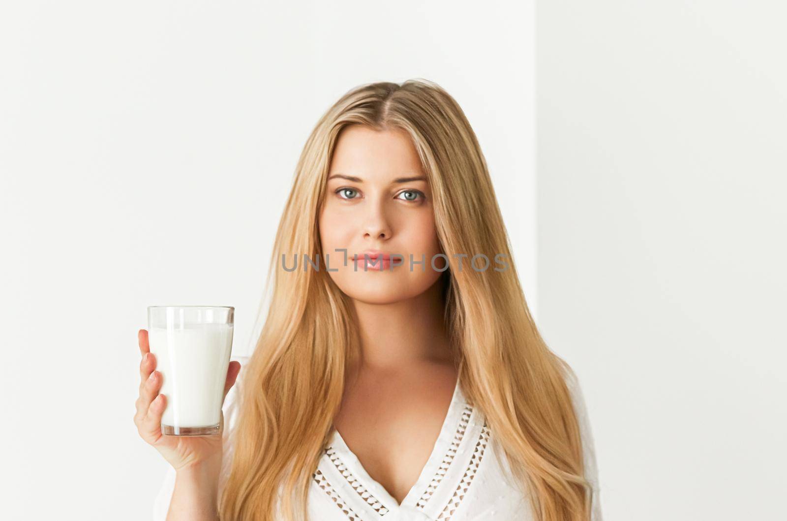 Diet, health and wellness, woman holding glass of milk or protein shake cocktail by Anneleven