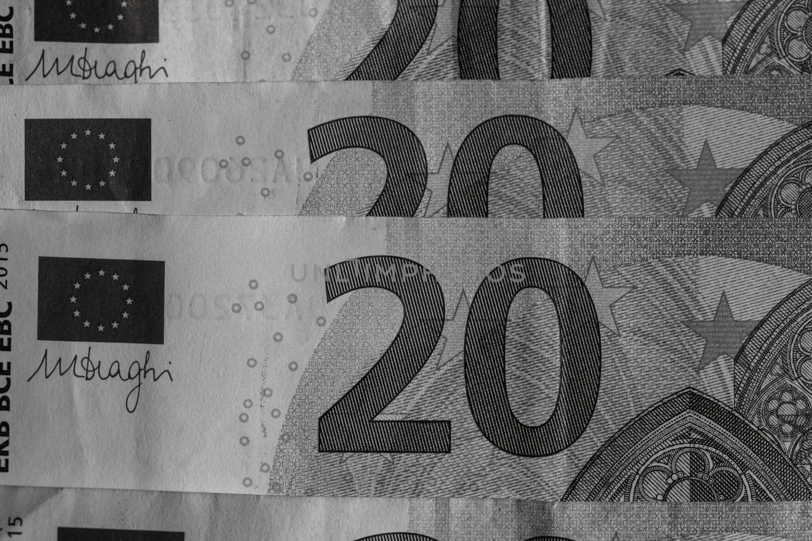 Selective focus on detail of euro banknotes. Close up macro detail of money banknotes, 20 euro isolated. World money concept, inflation and economy concept by vladispas