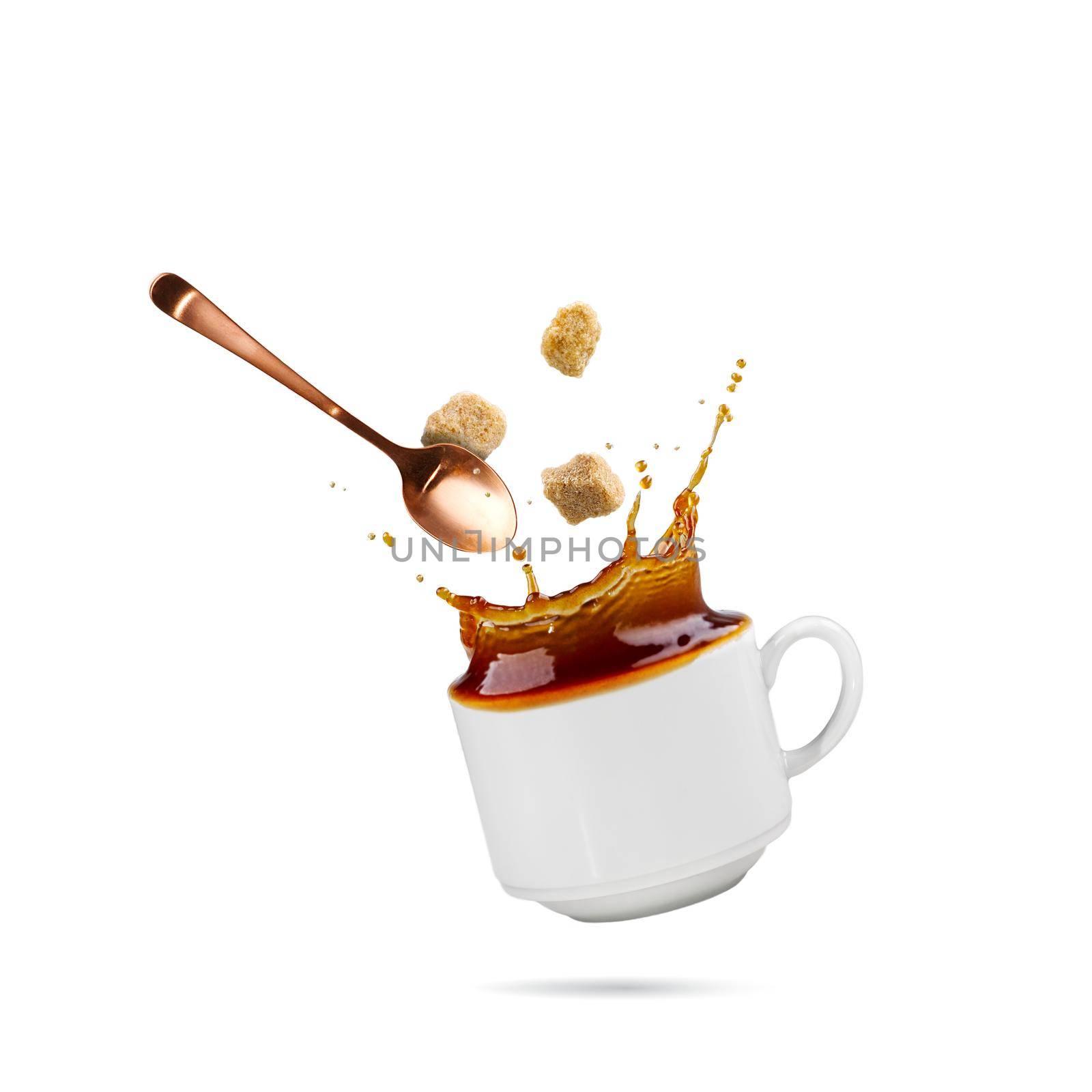 Falling coffee cup isolated on white. Cup of coffee splashes while falling. Splash in white coffee cup. Hot beverage splashing, food levitation