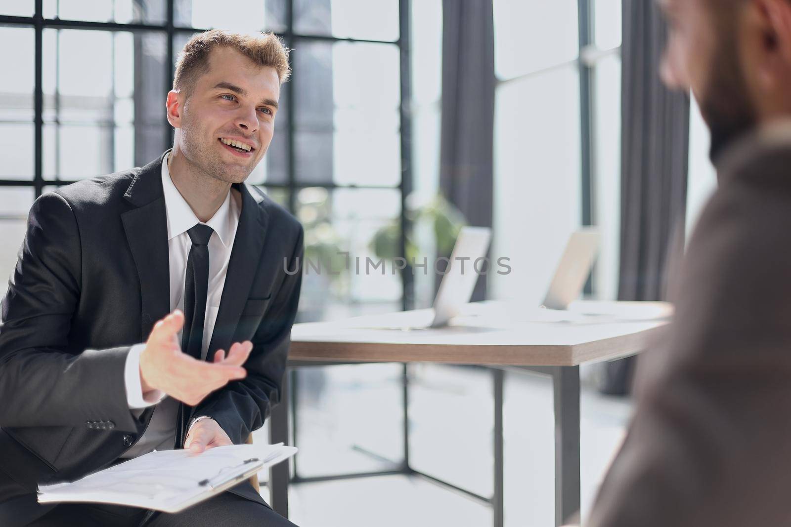 Manager interviewing a candidate in office by Prosto