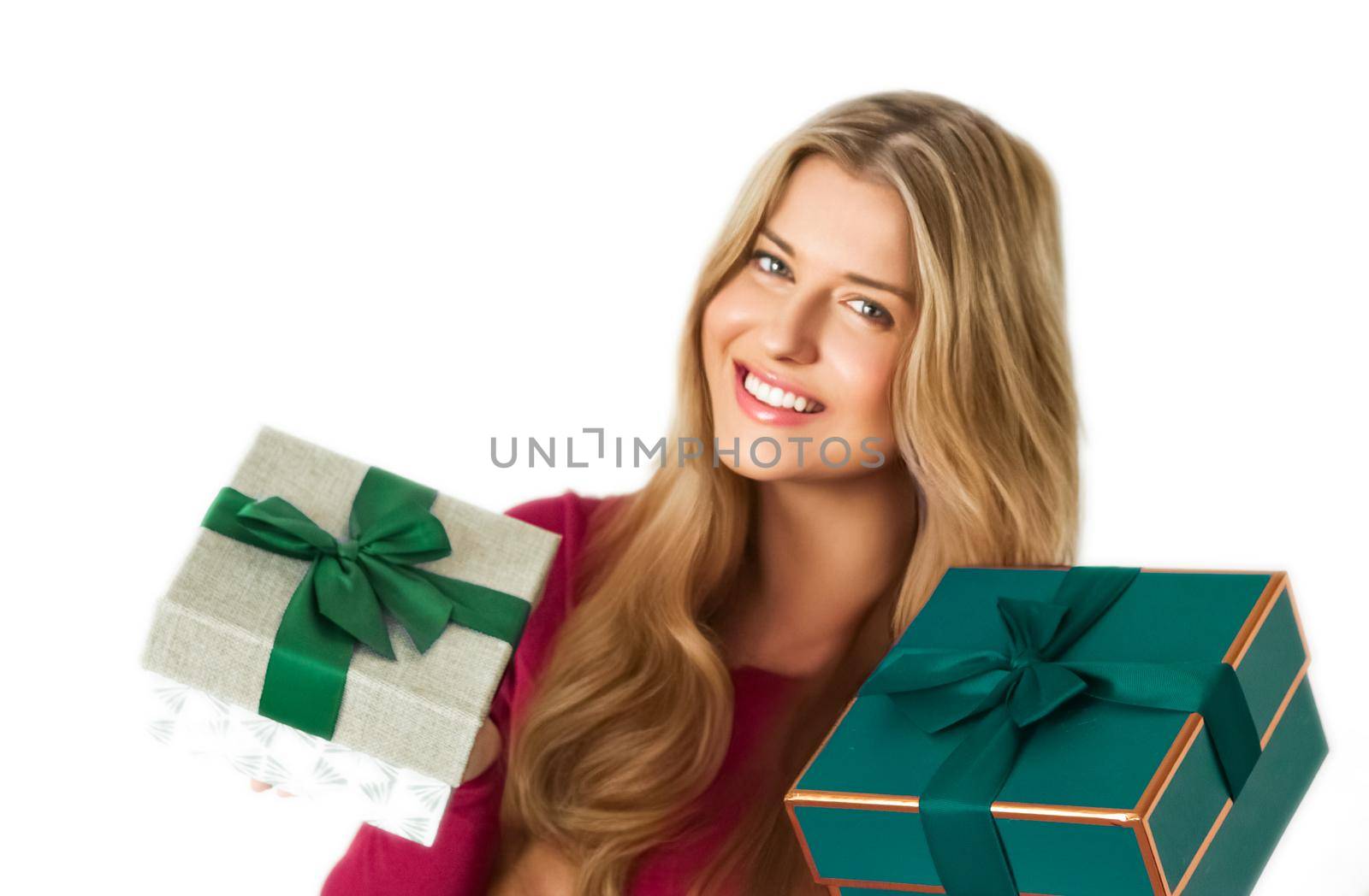 Christmas gifts and holiday presents, happy woman holding gift boxes isolated on white background, portrait