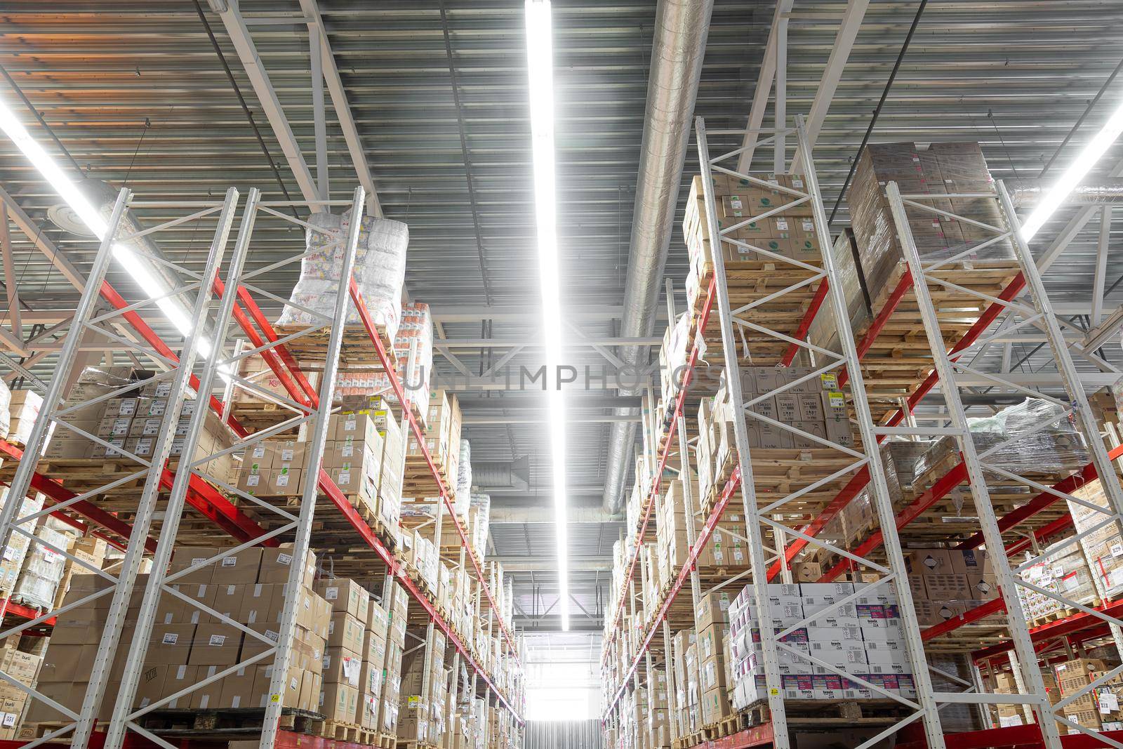 warehouse center with high racks for storing goods.