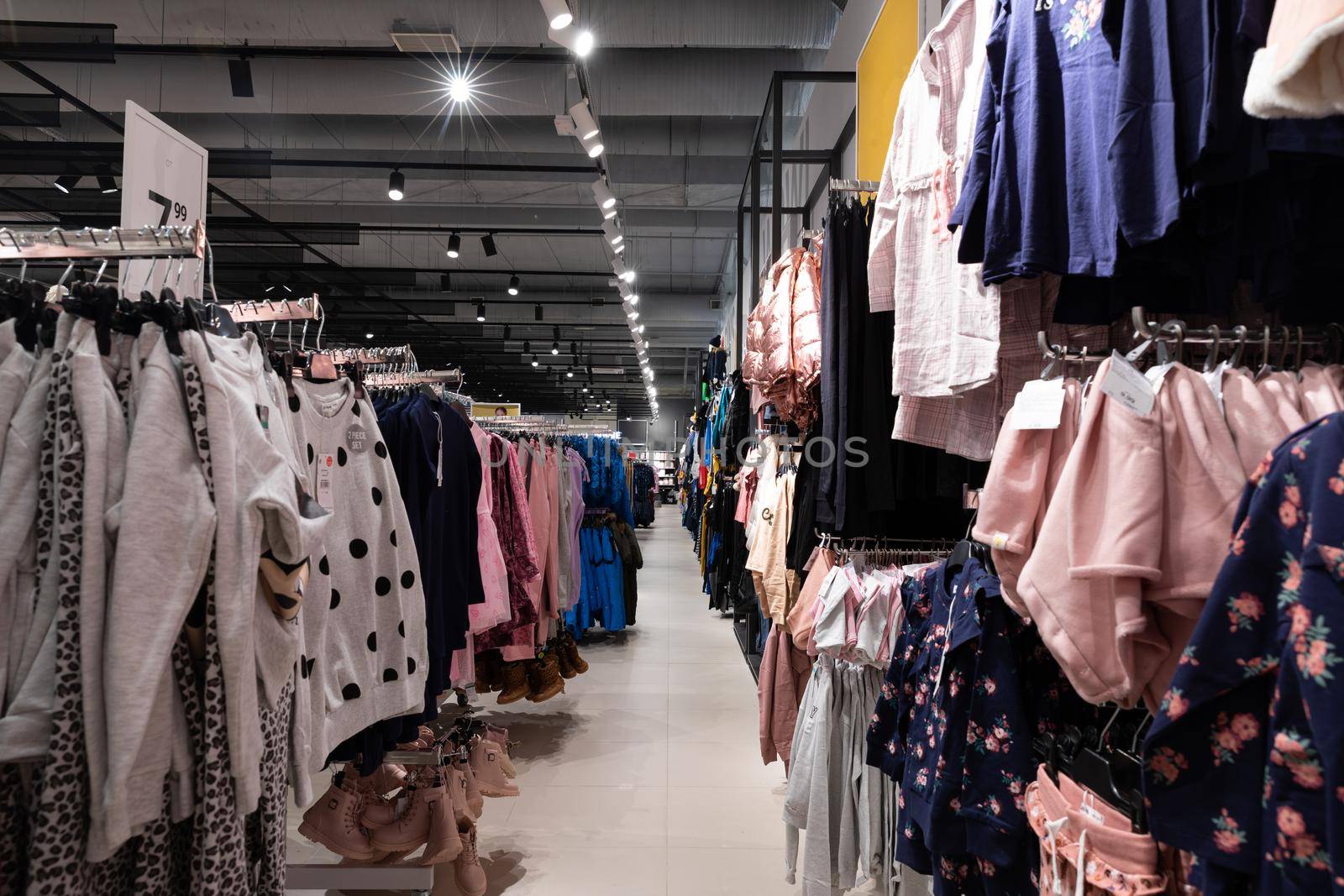 Rows of merchandise during a sale in an adult fashion store.