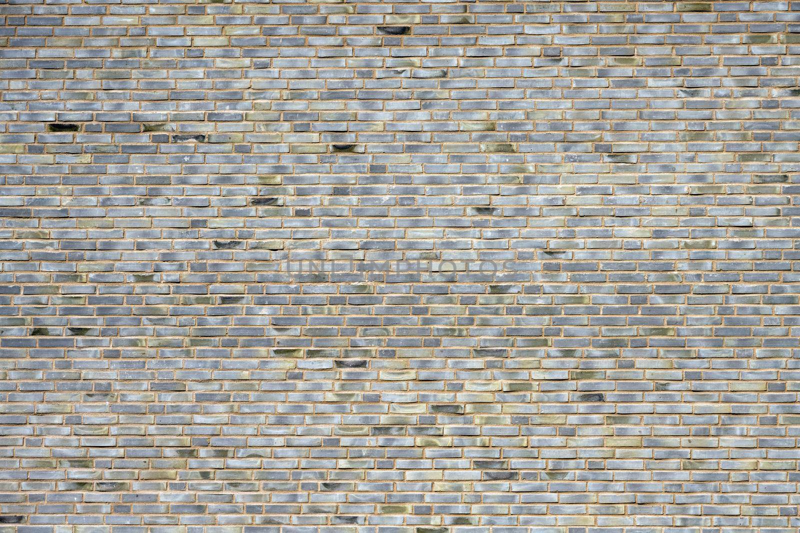 Large wall made of gray bricks by elxeneize