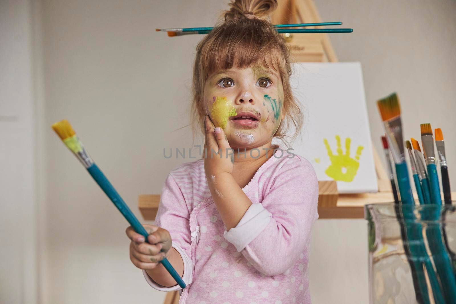 Charming child draws and stains everything with paints by Viktor_Osypenko
