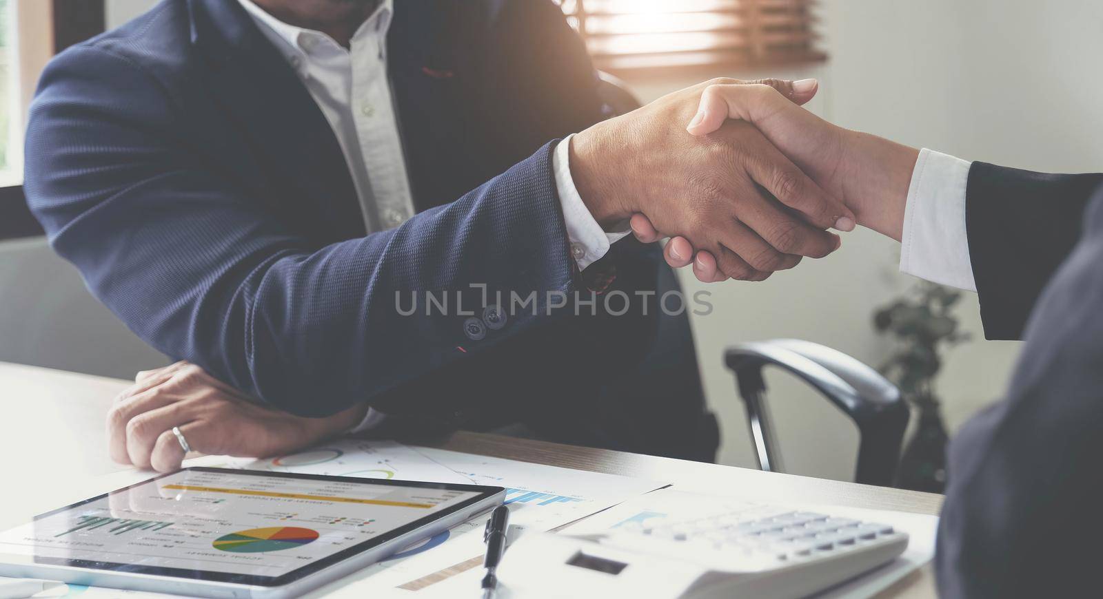 Business people shaking hands, finishing up meeting, business etiquette, congratulation, merger and acquisition concept by wichayada