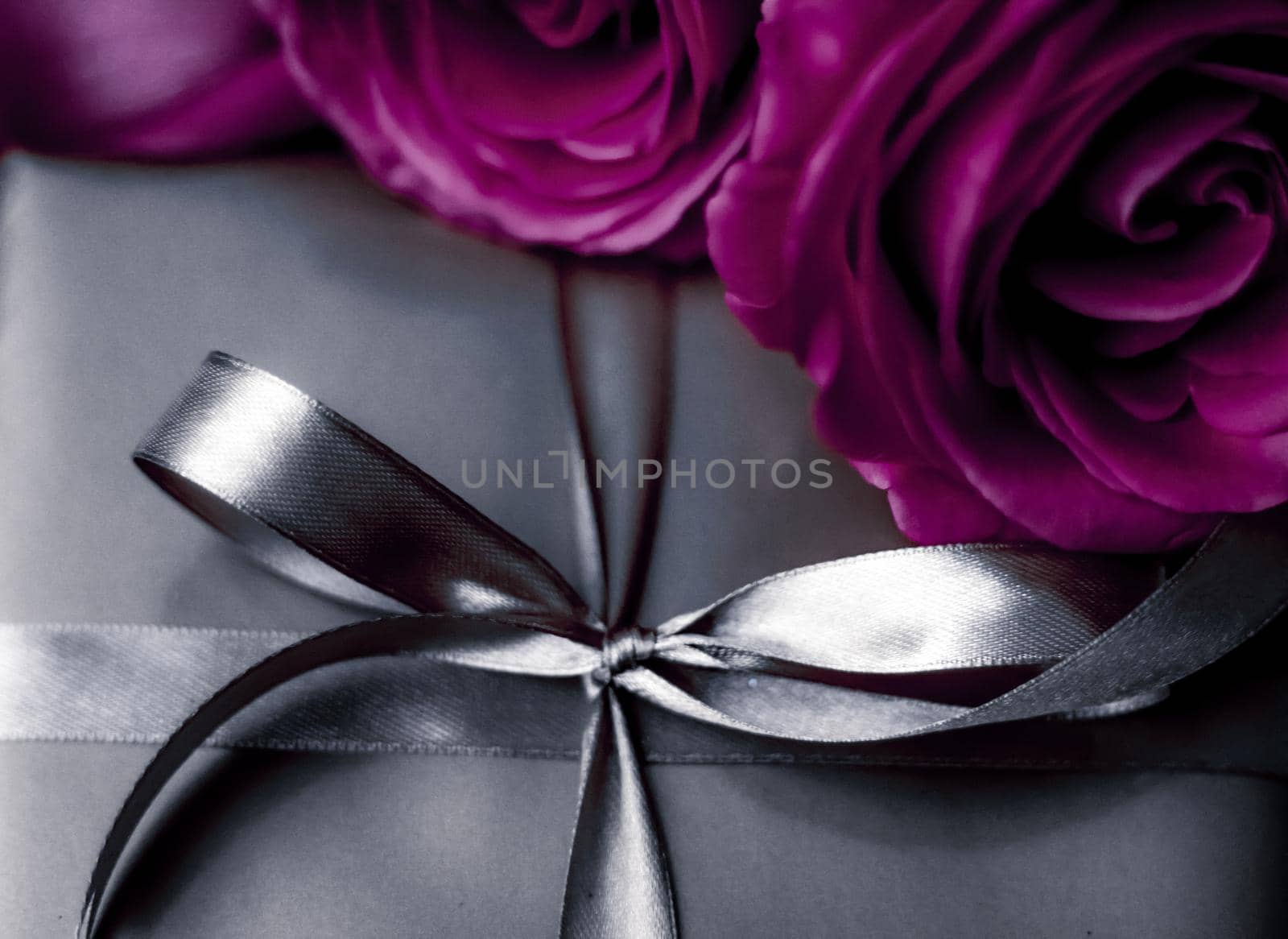 Luxurious design, shop sale promotion and happy surprise concept - Luxury holiday silver gift box and purple roses as Christmas, Valentines Day or birthday present