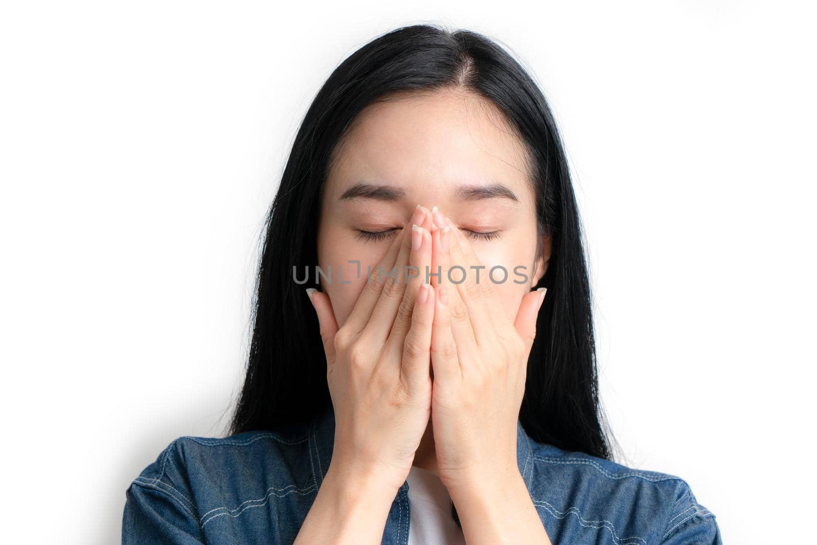 Asia woman having headache and feeling unwell and touching her faces on white background by Buttus_casso