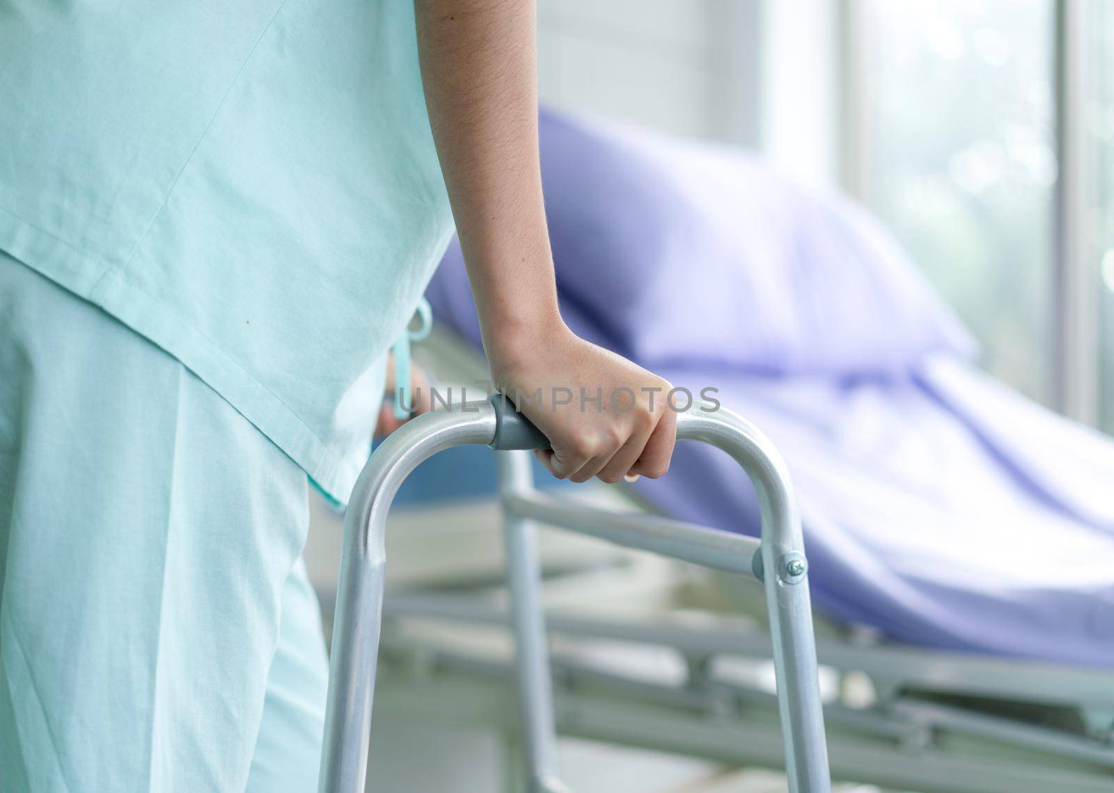 Patient use a walker after accident and cures at the hospital