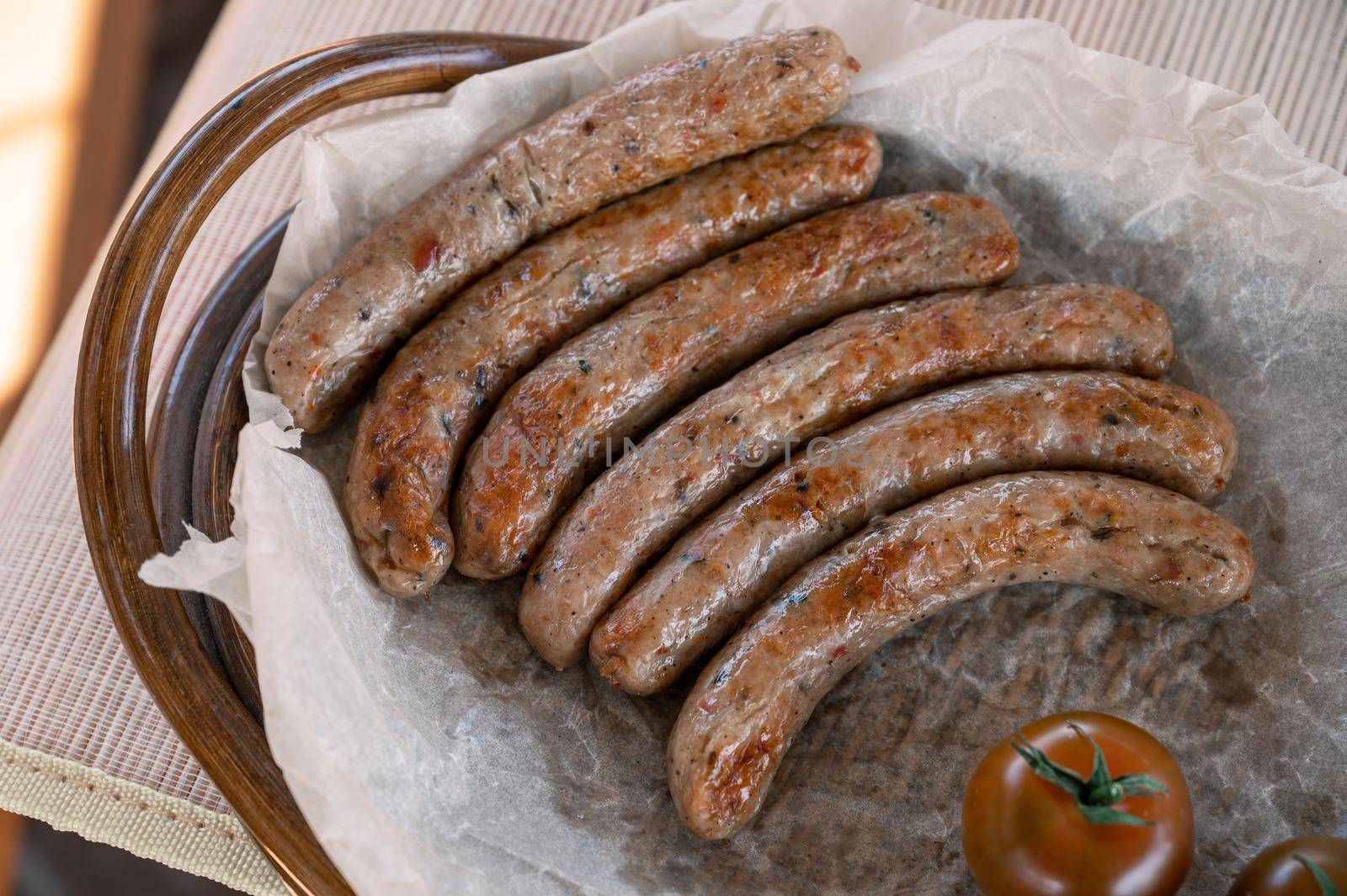 Grilled sausages with sauce and vegetables. Summer rest concept
