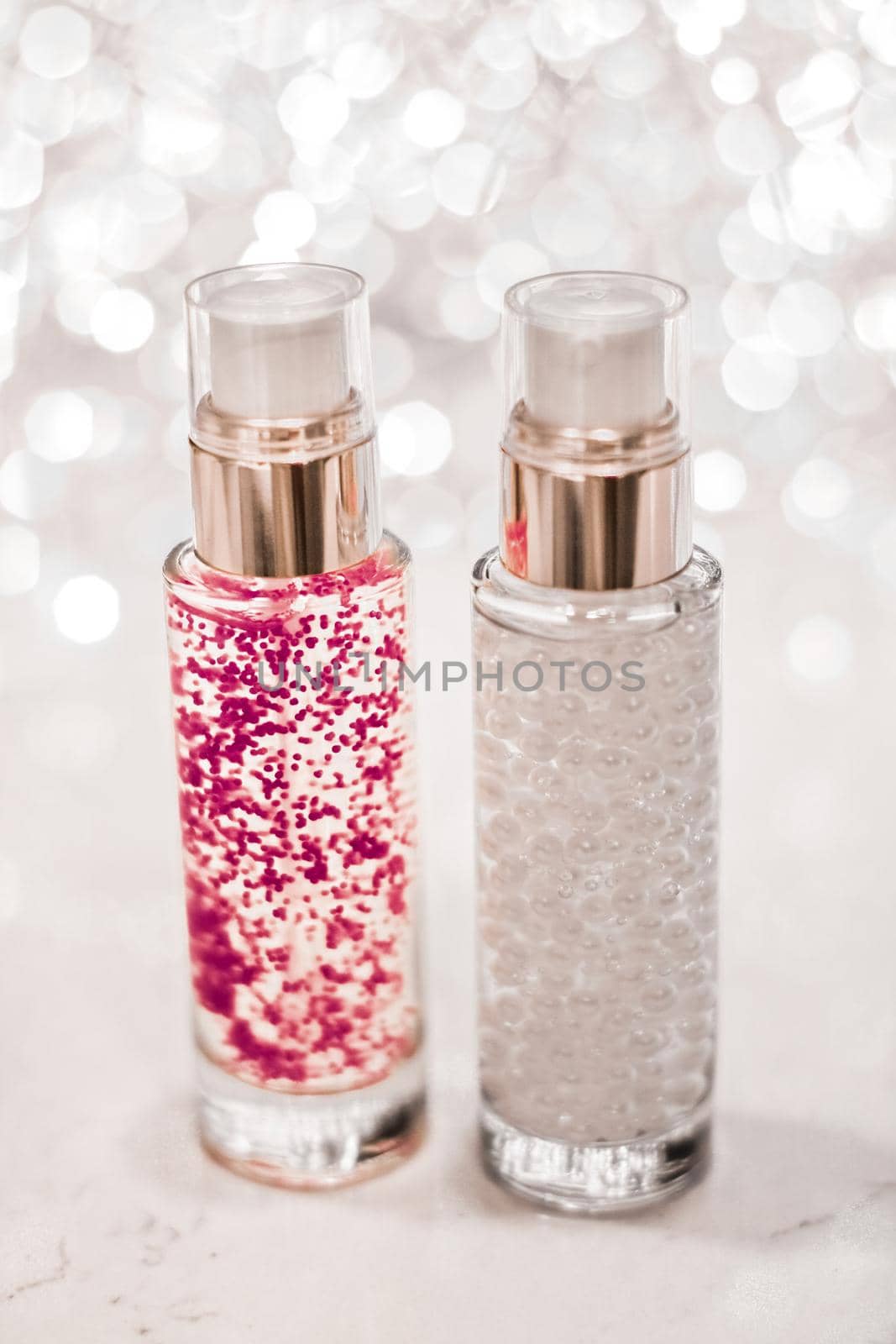 Cosmetic branding, blank label and glamour present concept - Holiday make-up base gel, serum emulsion, lotion bottle and silver glitter, luxury skin and body care cosmetics for beauty brand ads