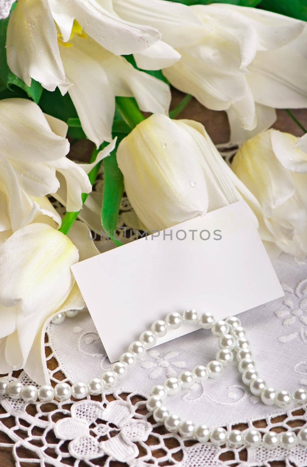 empty card form and white tulips. yellow tulips. bright spring flowers on wooden background by aprilphoto