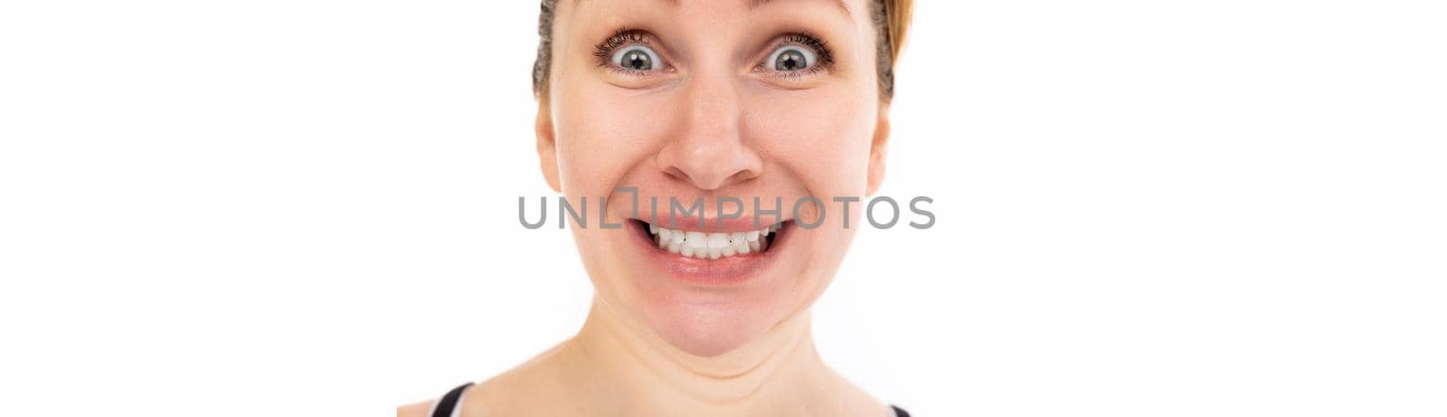 shocked middle-aged woman close-up portrait on white background.