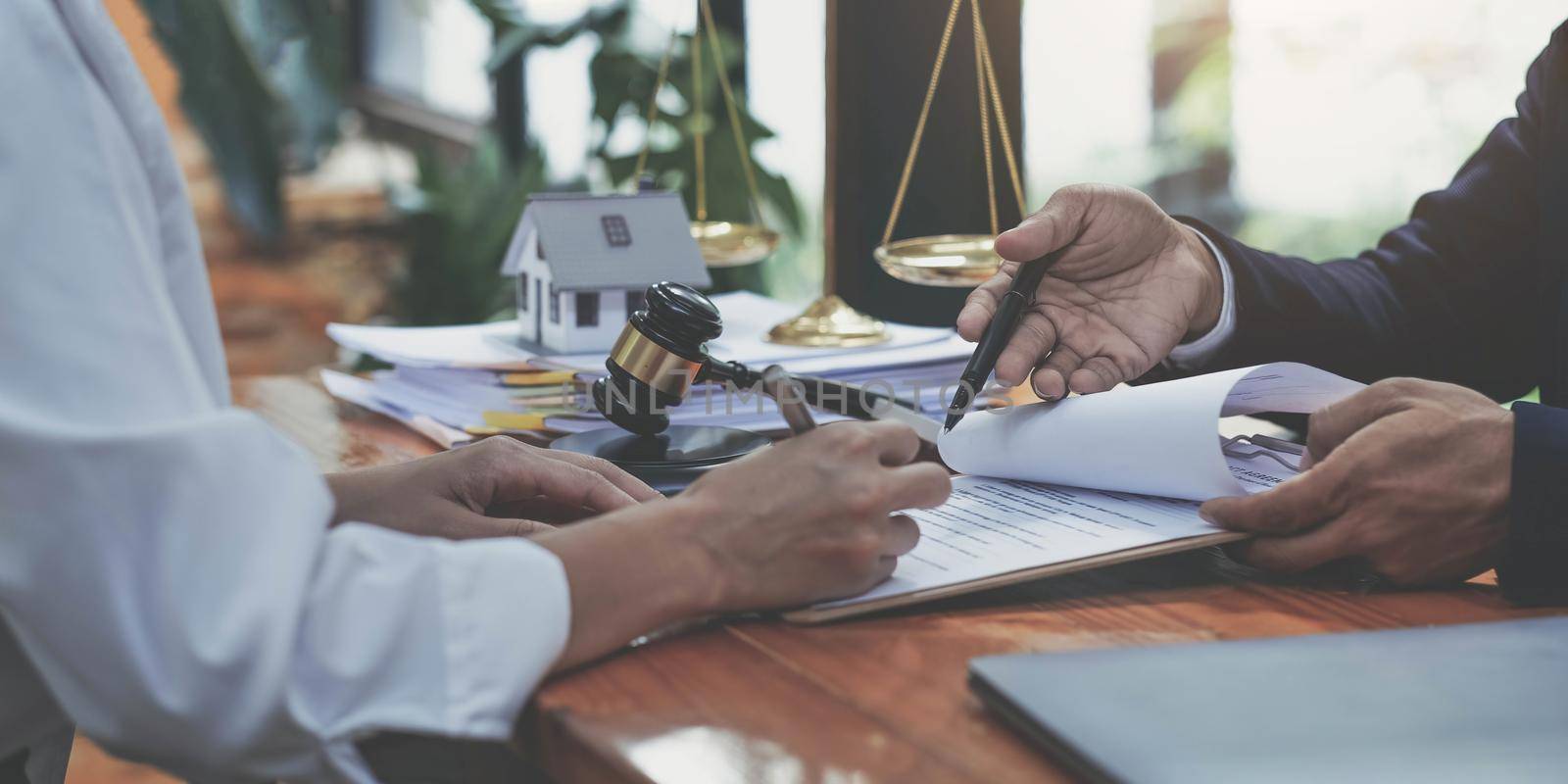 business people and lawyers discussing contract papers sitting at the table. Concepts of law, advice, legal services.