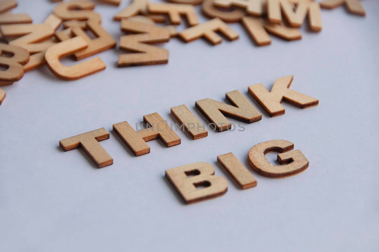 Think big text on white cover background. Inspirational concept.