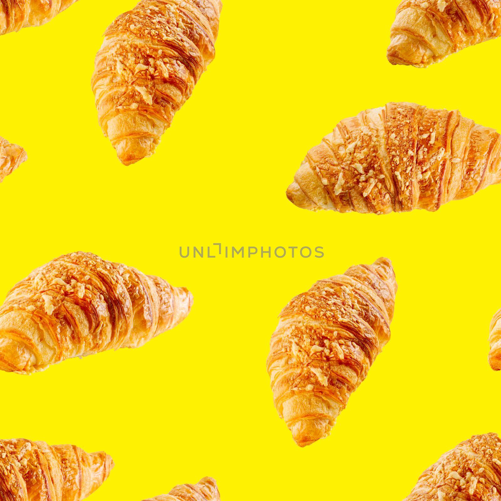 seamless pattern made from Fresh croissant isolated on yellow background. Bakery pattern with baked croissant with cheese.