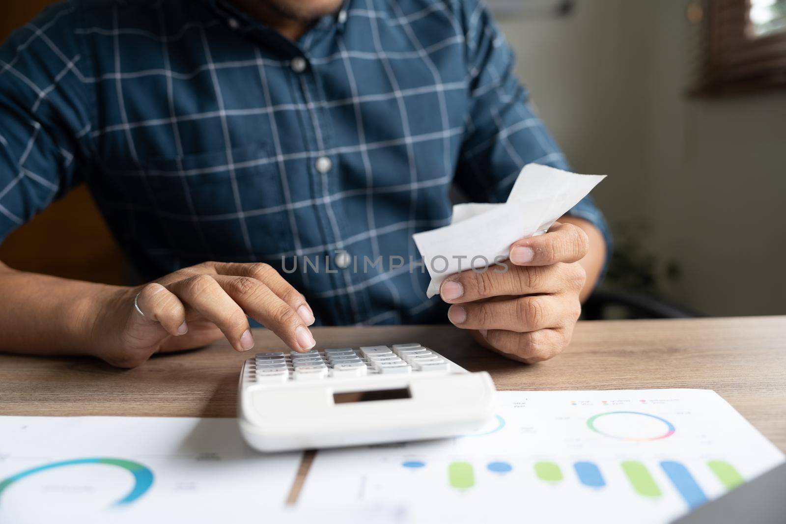 Young asian man calculating expenses household about finance and frustrated on desk at home, male checking bill having stress and worried, debt and tax, expression and emotion, business concept