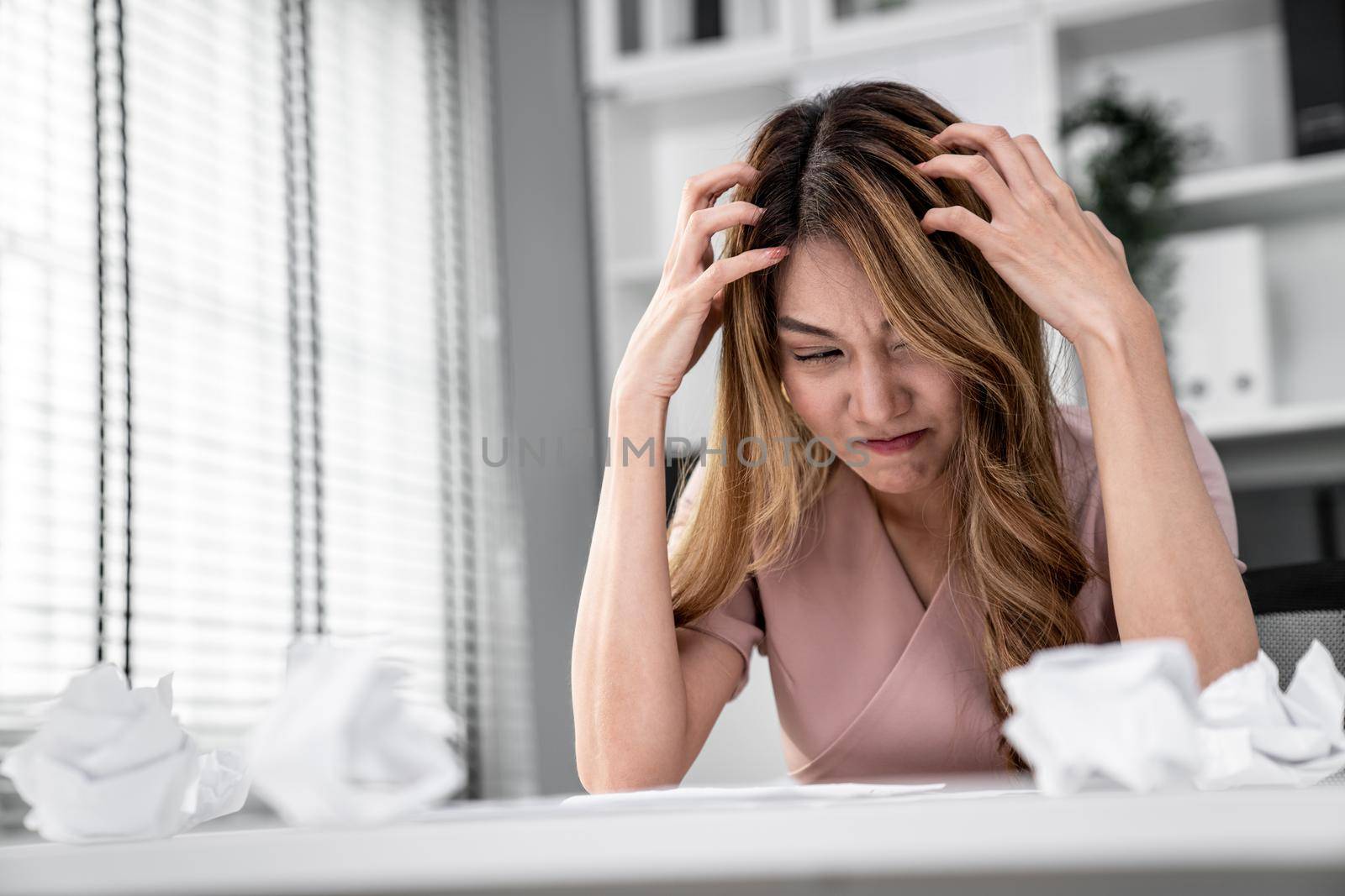 A competent female employee who has become completely exhausted as a result of overburdened work. Concept of unhealthy life as an office worker, office syndrome.