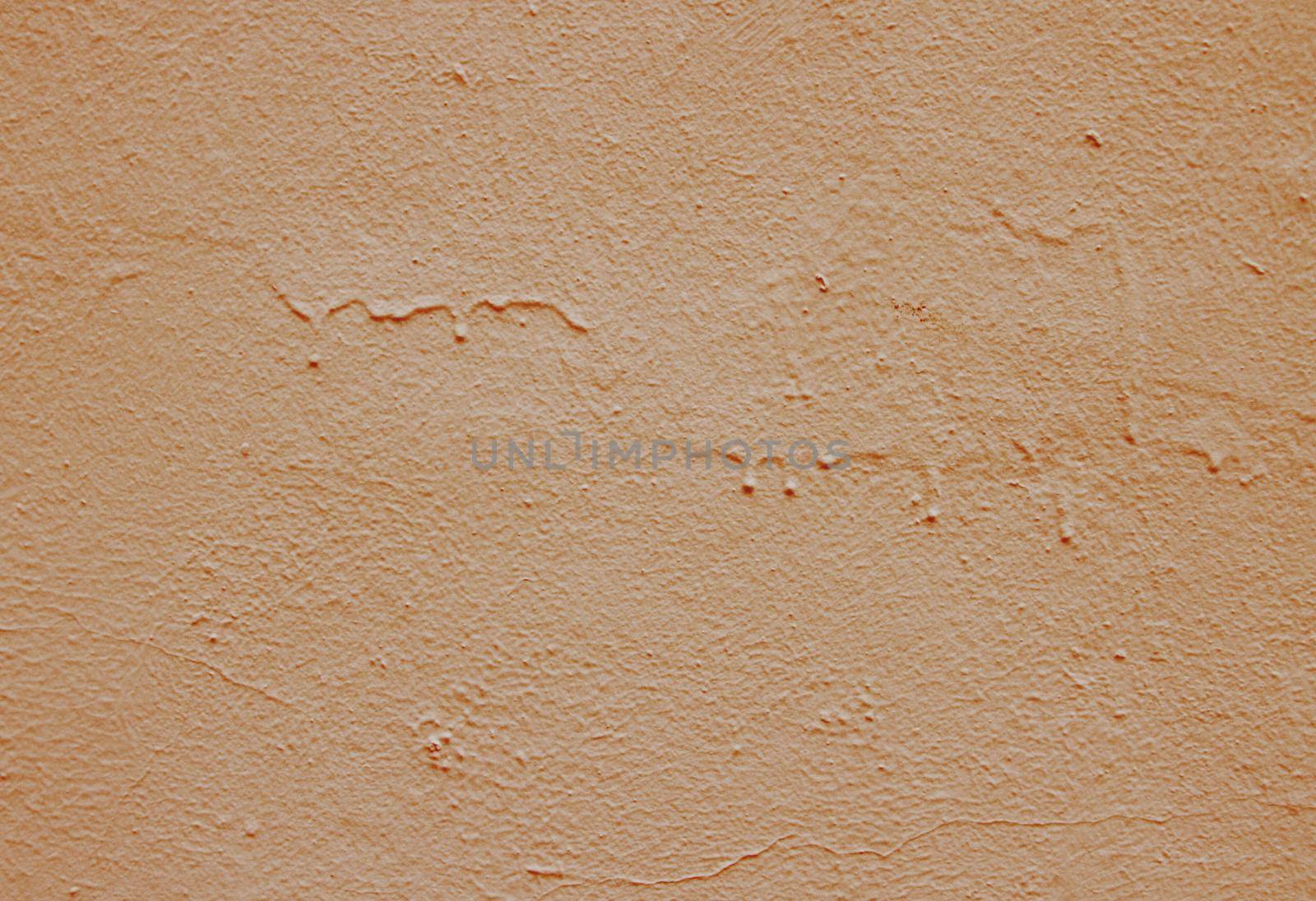 Old peeling paint on the wall. Brown abstract background..Beautiful brown textured stucco on the wall..Background from brown stucco..Background from brown stucco.