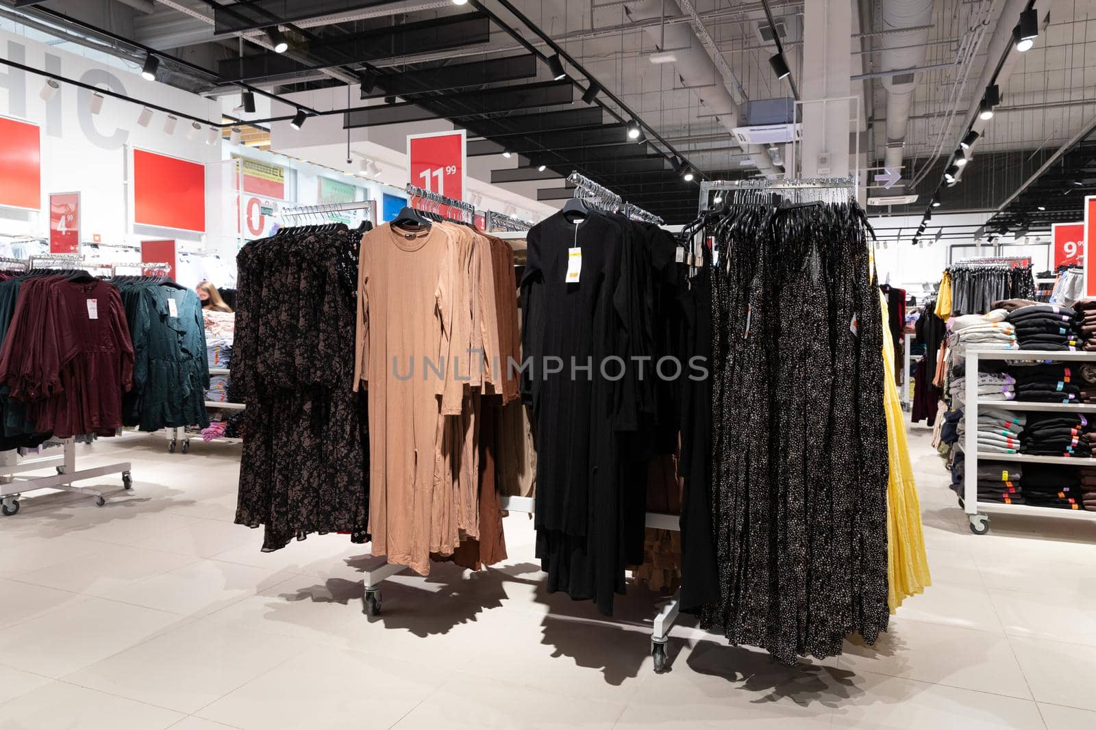 fashion store for women, evening dresses on a hanger, a wide selection of goods.