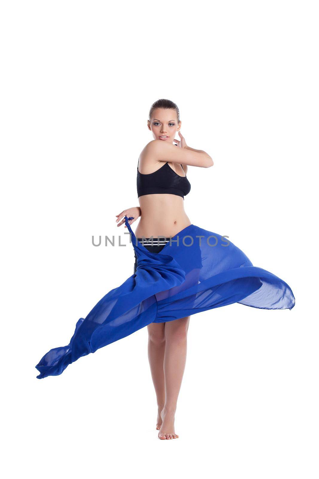 happy young woman dance in fitness cloth with flying fabric