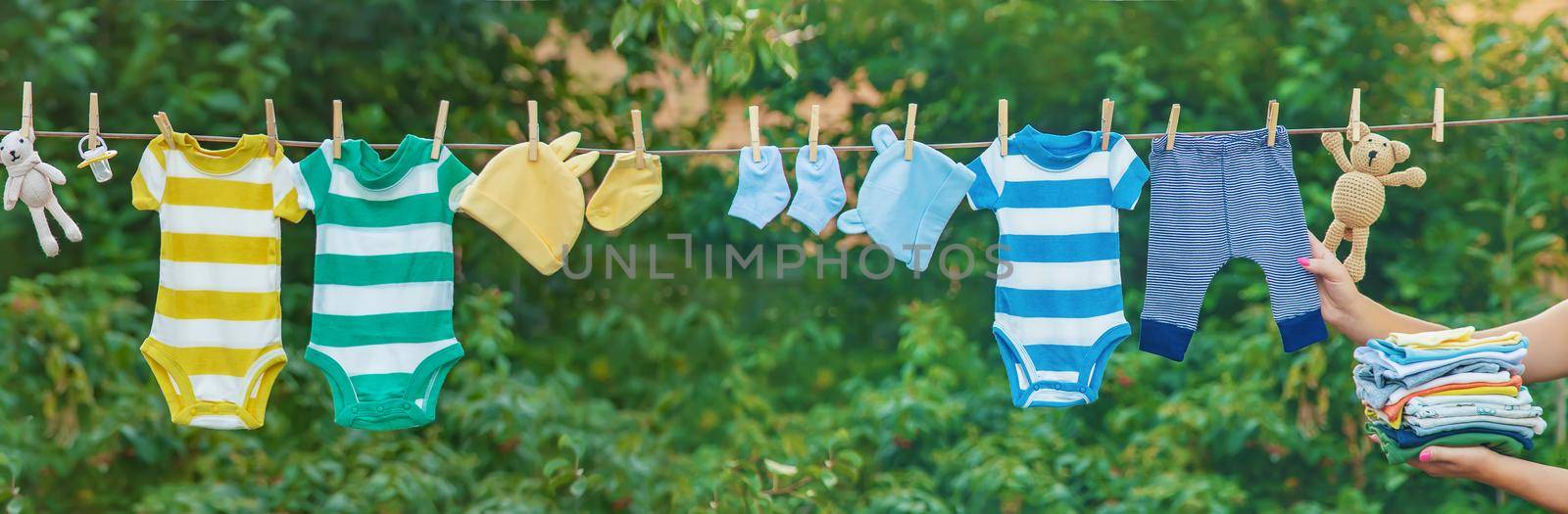 washing baby clothes. Linen dries in the fresh air. Selective focus. by yanadjana