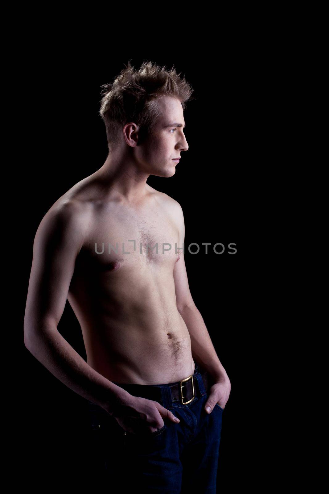 Studio portrait of young man with naked torso