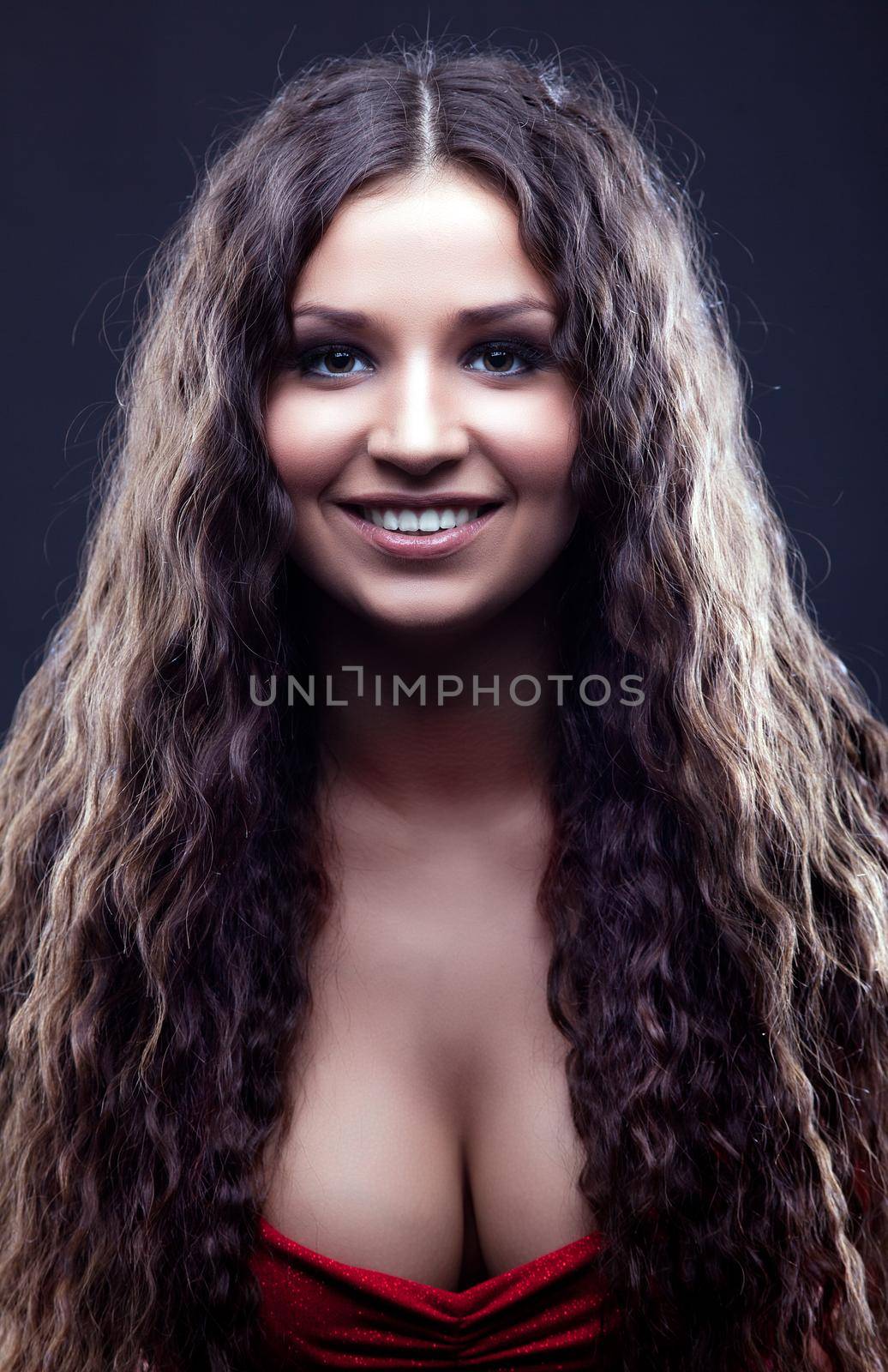 Young amazing girl with curly hair smile by rivertime