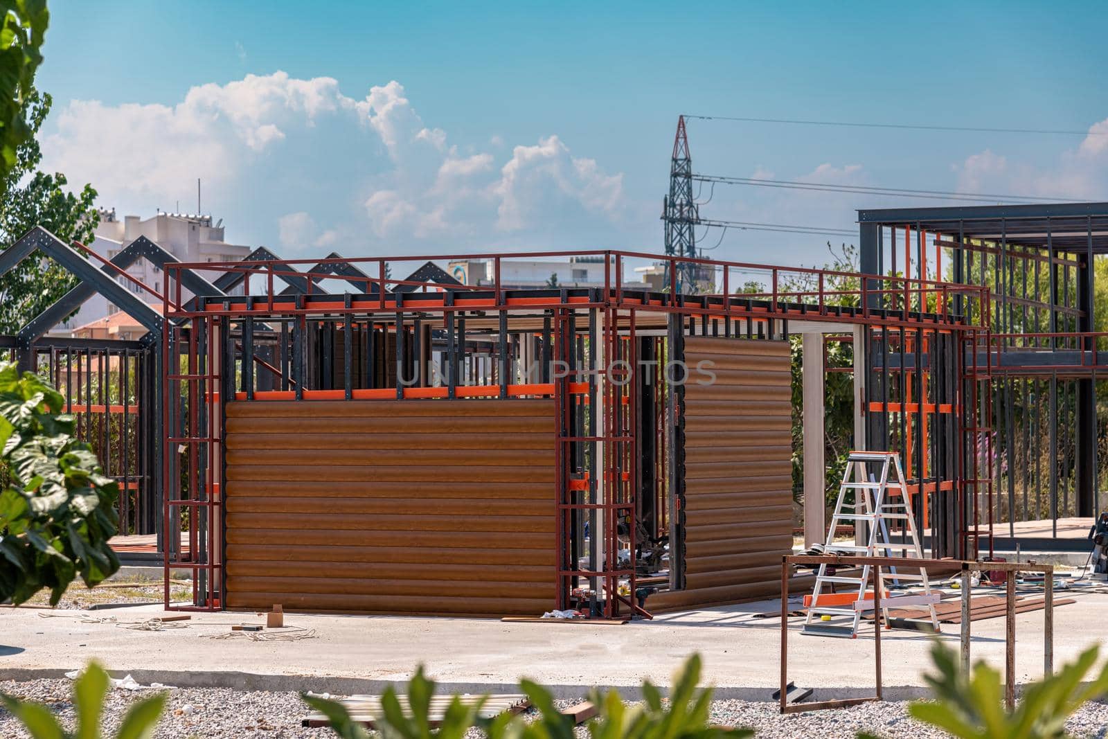 Metal frame of newly built building. Construction of a new tiny house