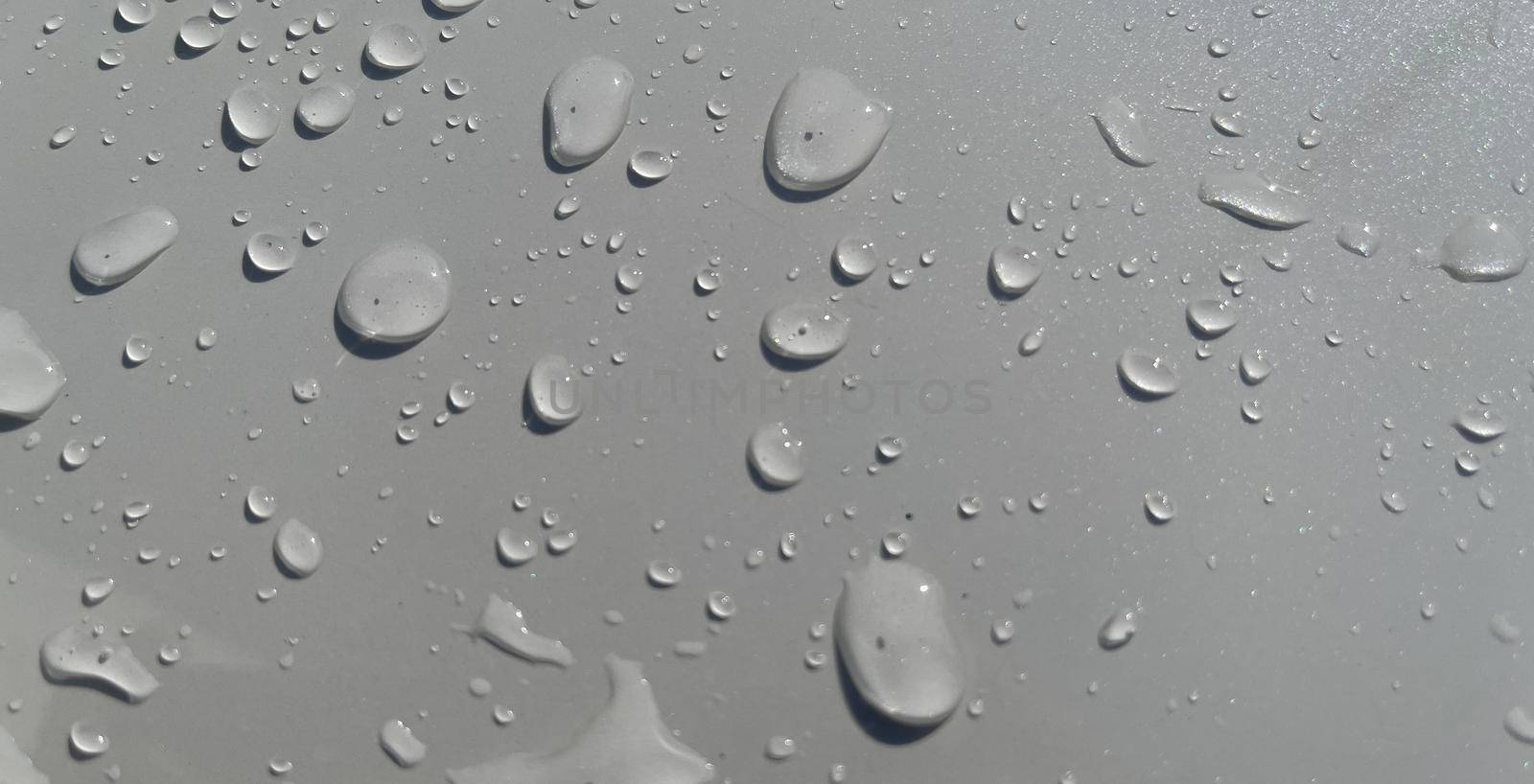 Water droplets perspective through white color surface good for multimedia content backgrounds, fresh dew