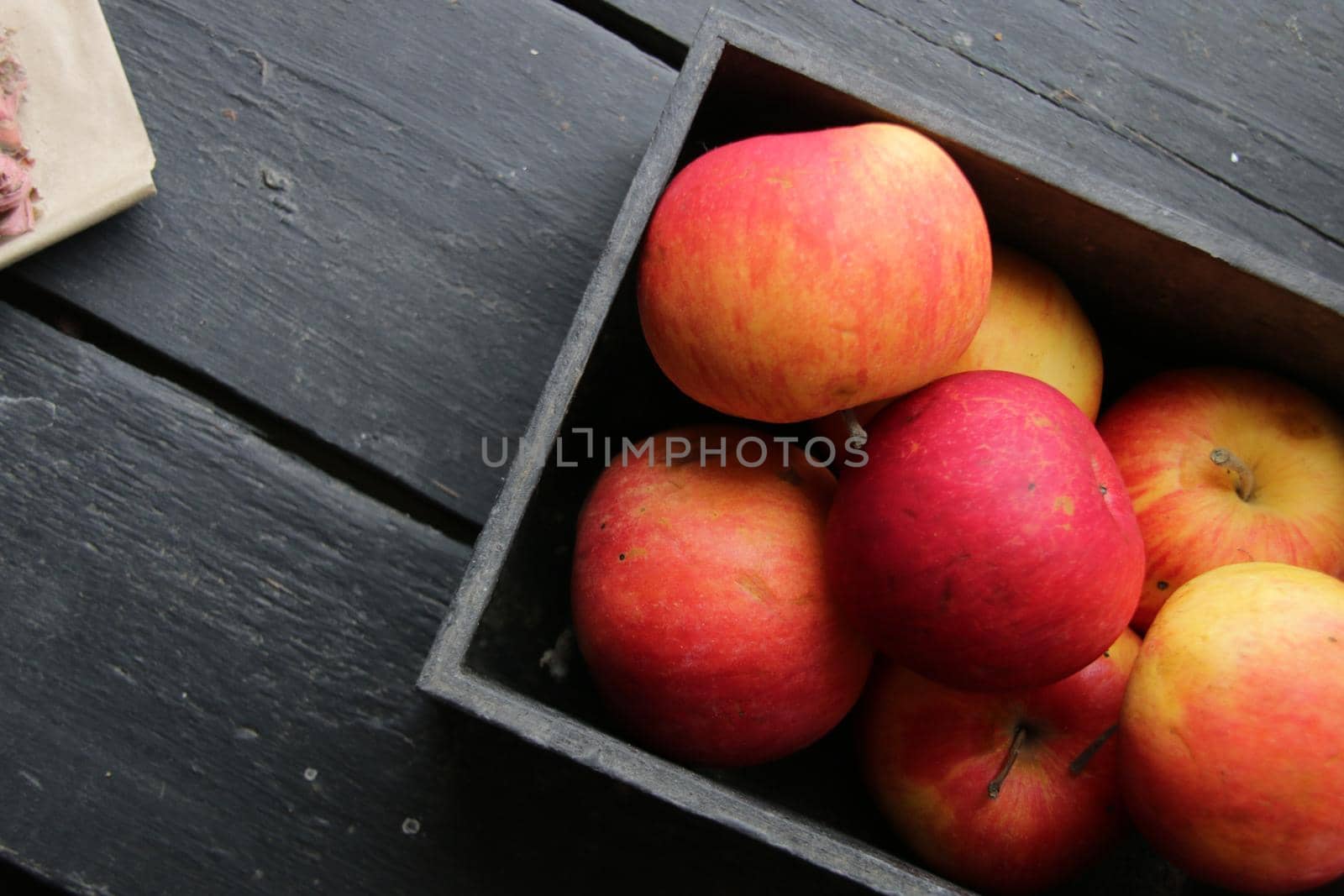 Ripe red apples on wooden table. Top view. by Markgraf