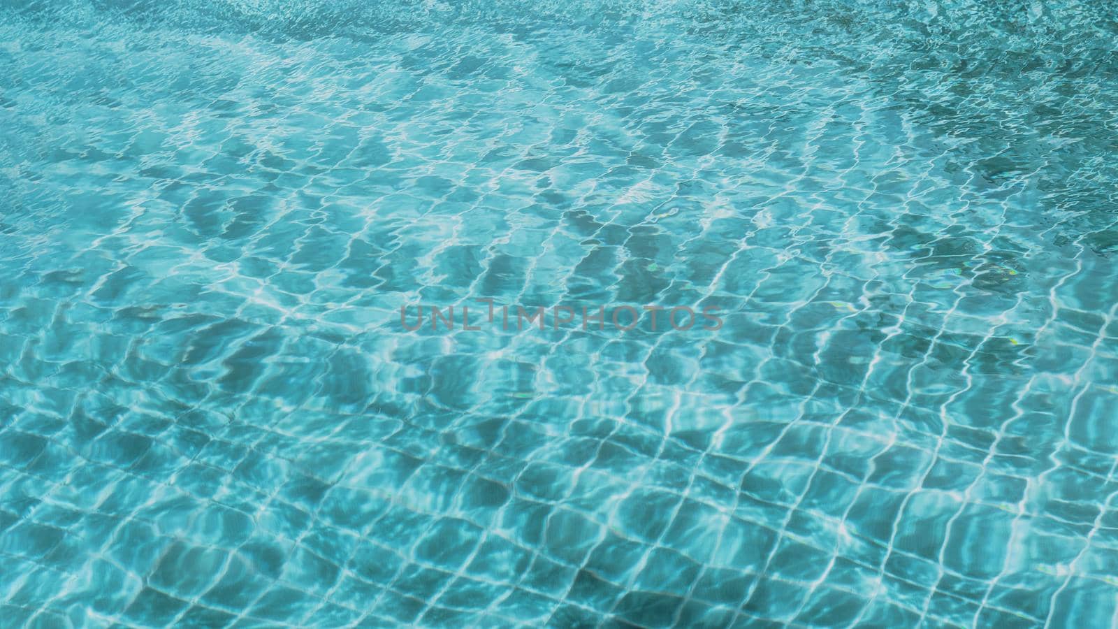 Abstract background Patterns Ripped water Surface swimming pool Light Reflection Vibrant blue green.