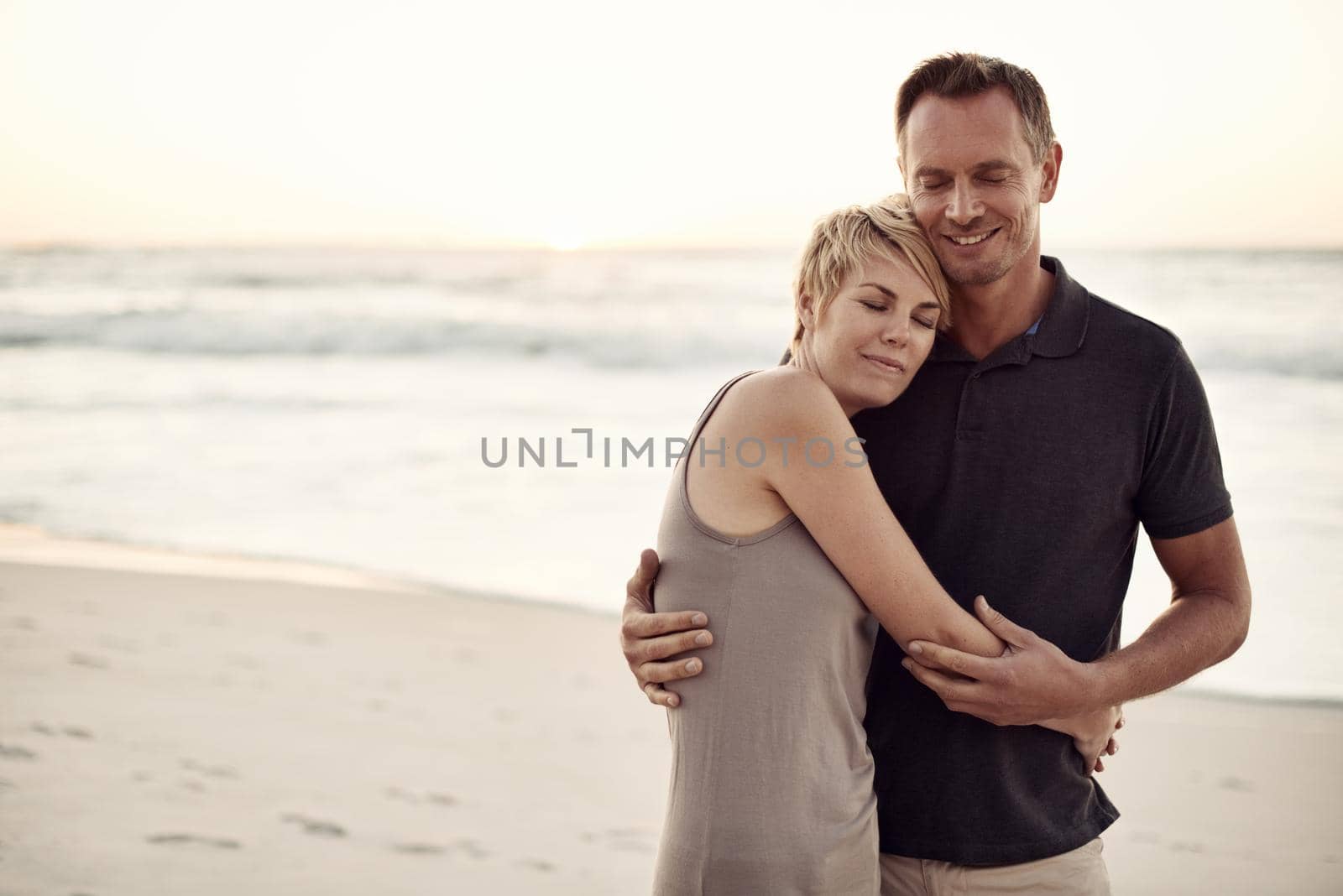 Falling in love all over again. a mature couple enjoying a day at the beach