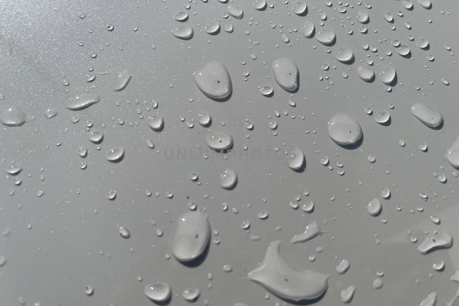 Water droplets perspective through white color surface good for multimedia content backgrounds, fresh dew