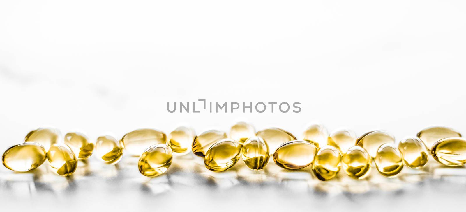 Pharmaceutical, branding and science concept - Vitamin D and golden Omega 3 pills for healthy diet nutrition, fish oil food supplement pill capsules, healthcare and medicine as pharmacy background