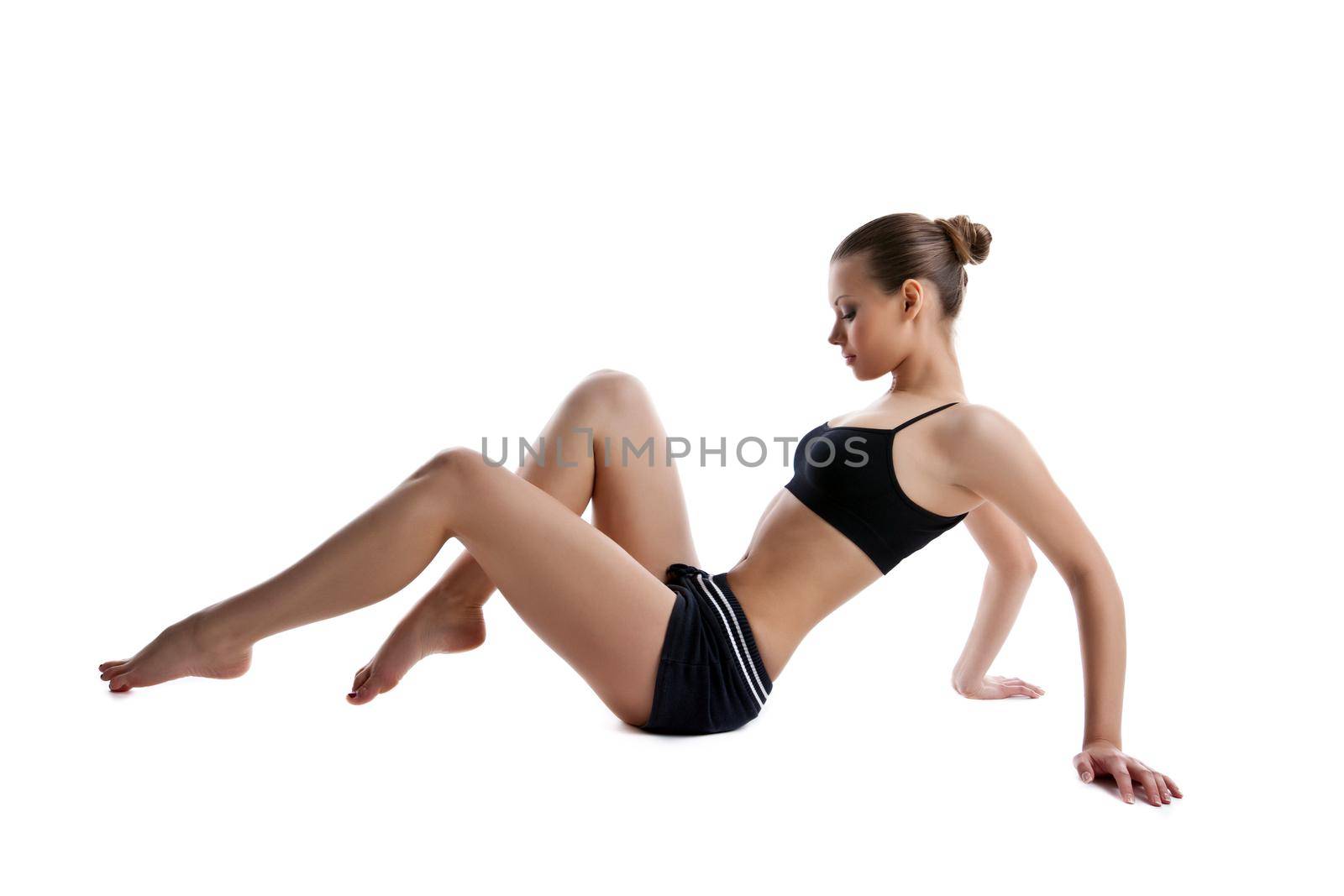 young woman sit on white in fitness dress by rivertime