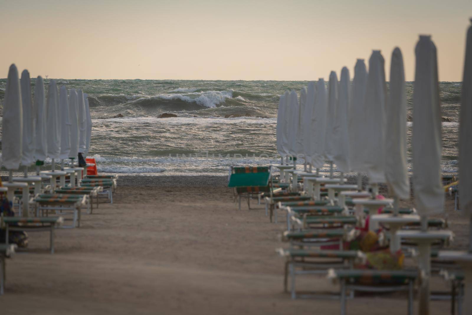 High waves roll up on the beach by Robertobinetti70