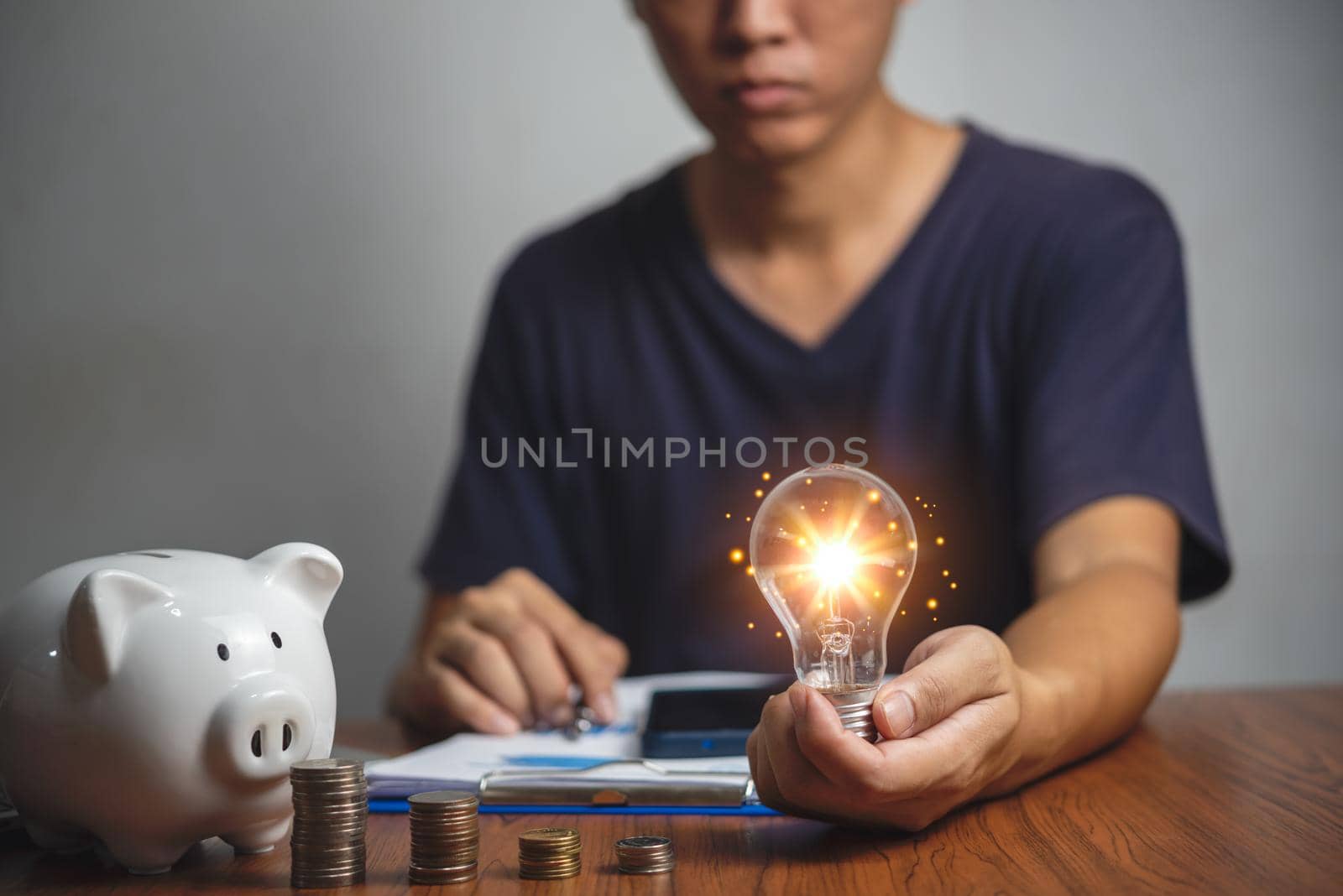 Business growth strategy profit knowledge stack investment wealth financial.businessman holding light bulb creativity concept economic energy. by aoo3771